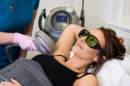Client receiving laser treatment at Hunter House Clinic
